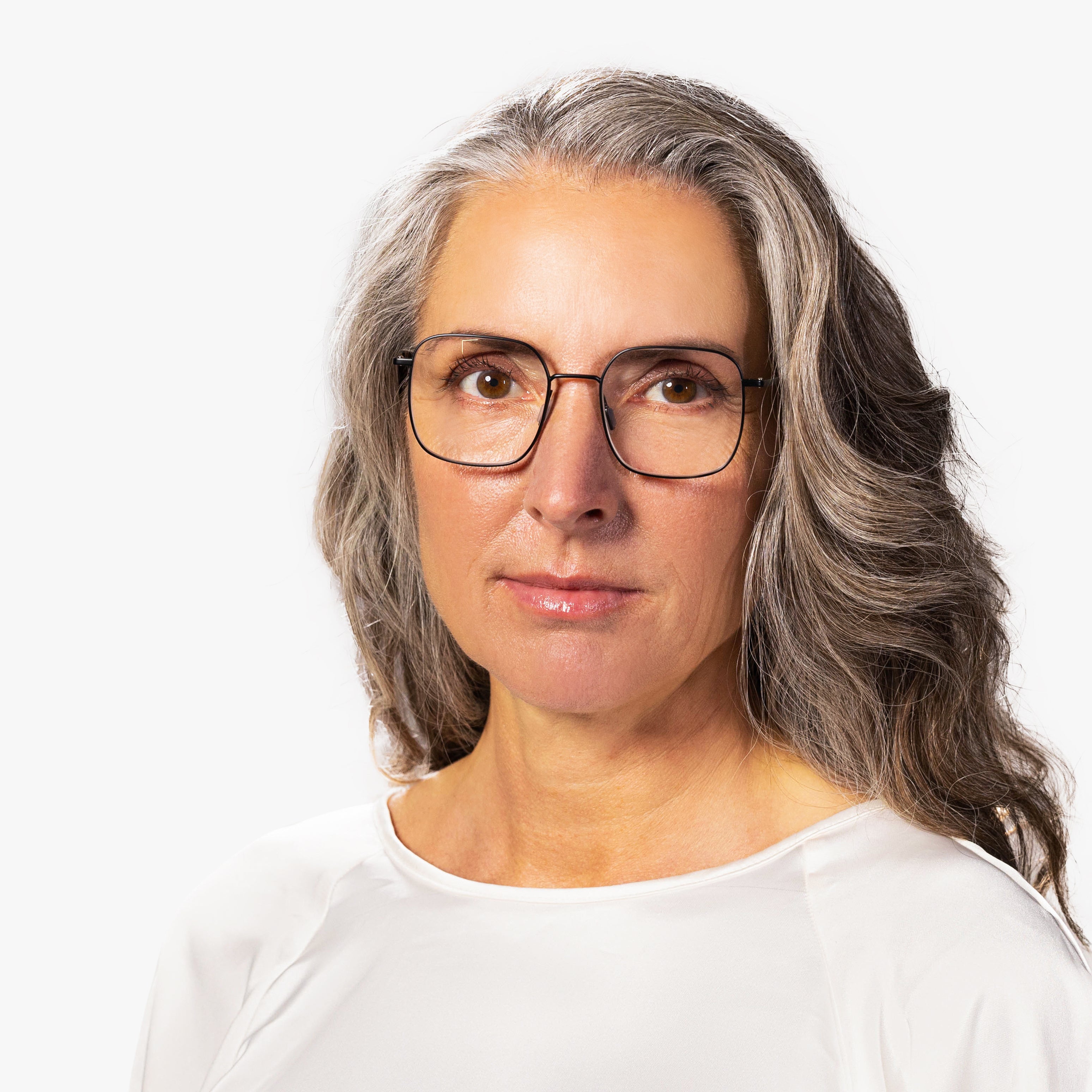 Person wearing Women's Båstad Black reading glasses with thin frames