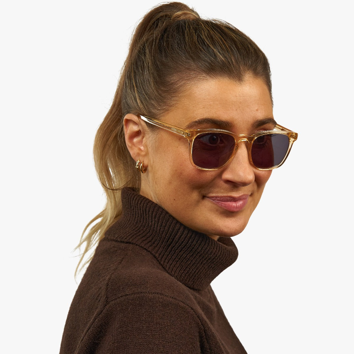 Person wearing crystal lemon sunglasses