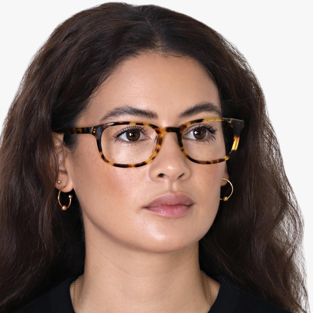 Person wearing tortoiseshell eyeglasses