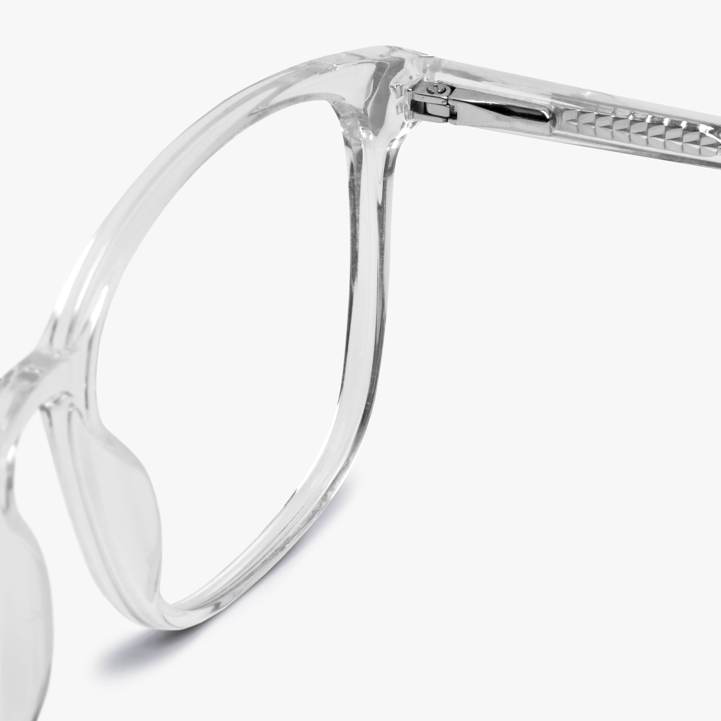 Close-up of crystal white glasses frame with metal hinge