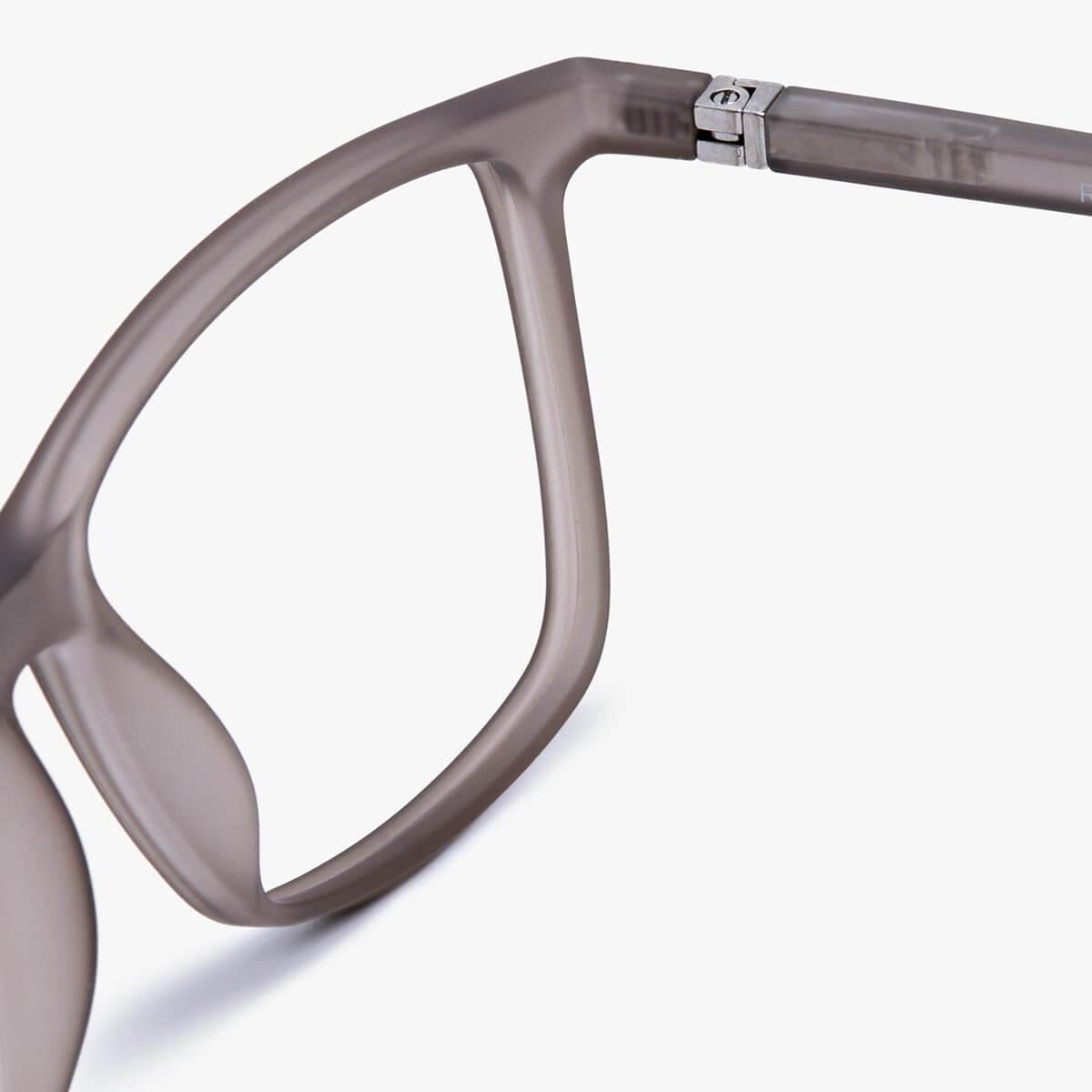 Close-up of women's grey acetate glasses frame with silver hinge