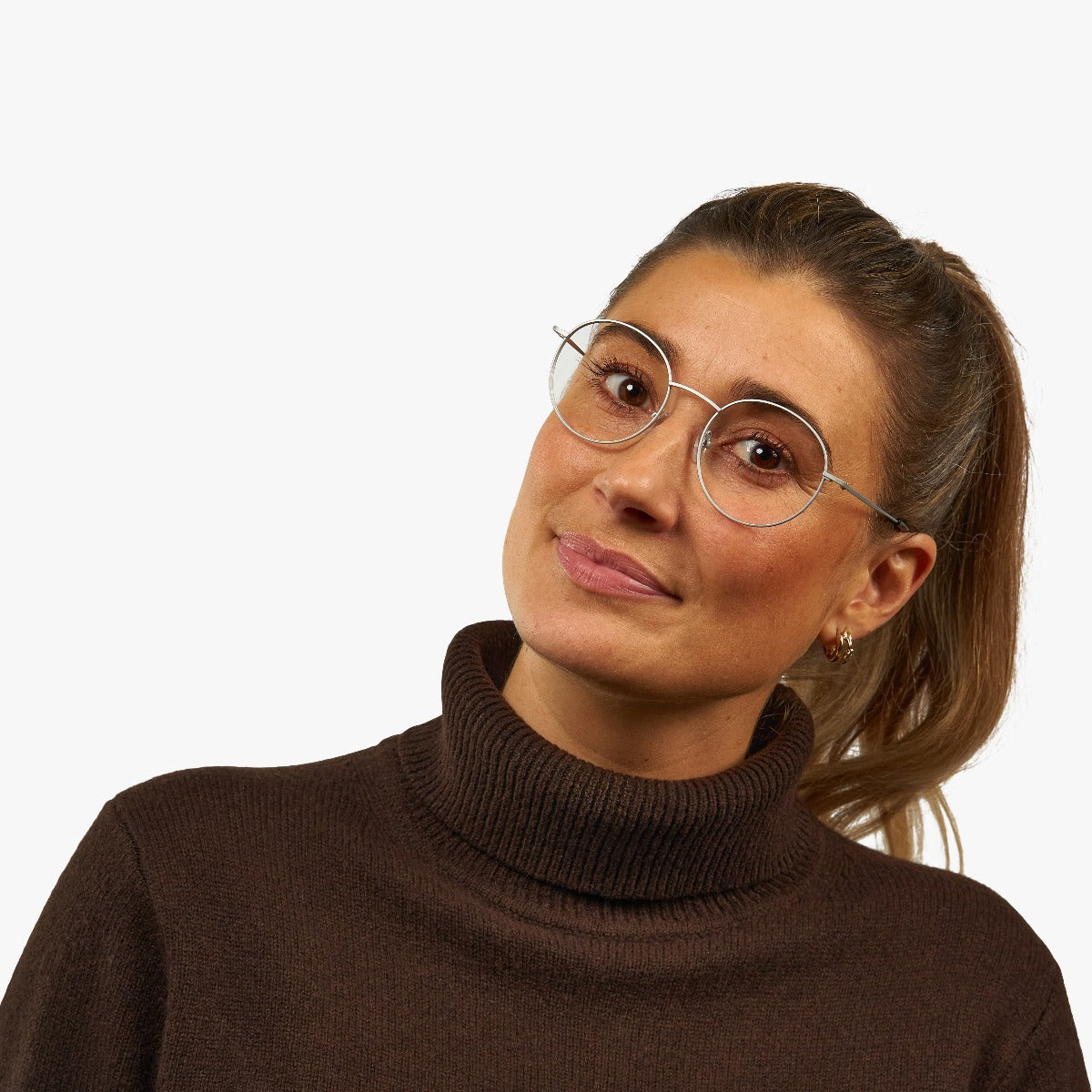 Person wearing round steel glasses